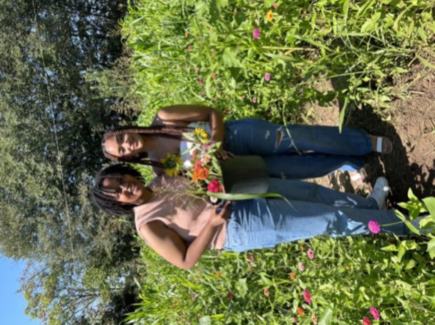 Visitors with fresh-cut flower bouquets from Urban Sprout Farms